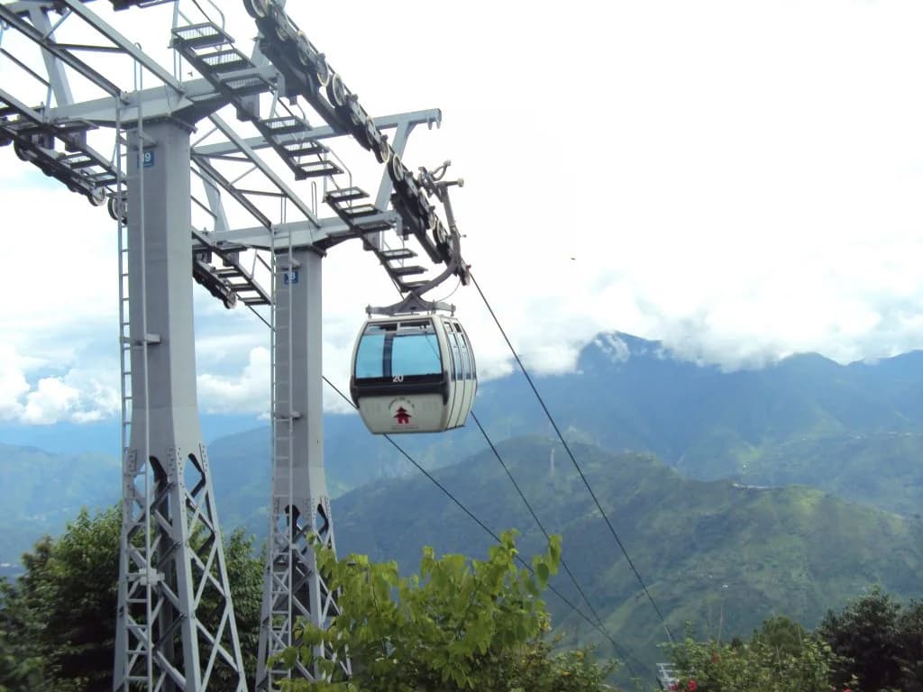 Manakamana cable car passing a support tower